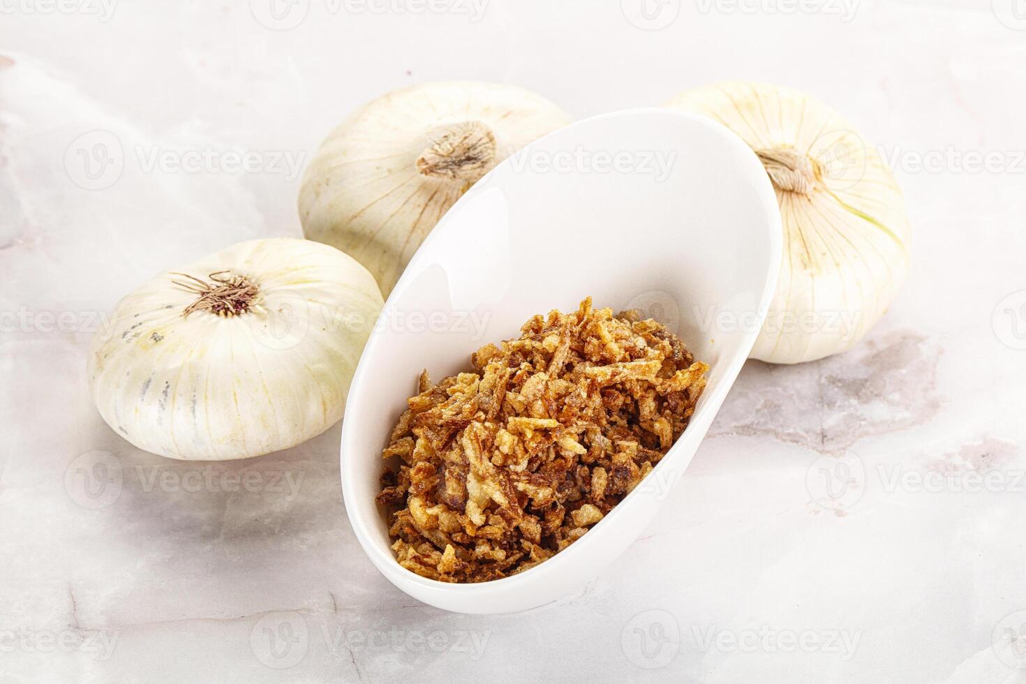Dried roasted onion flakes for culinary photo