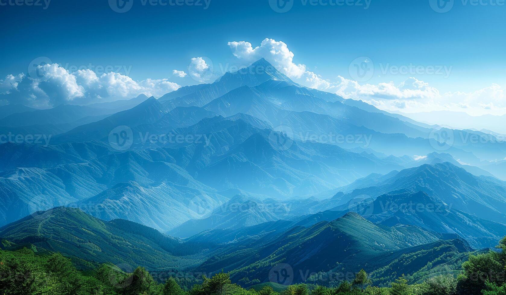 The mountains are covered in trees and the sky is blue. The mountains are very tall and the sky is clear photo