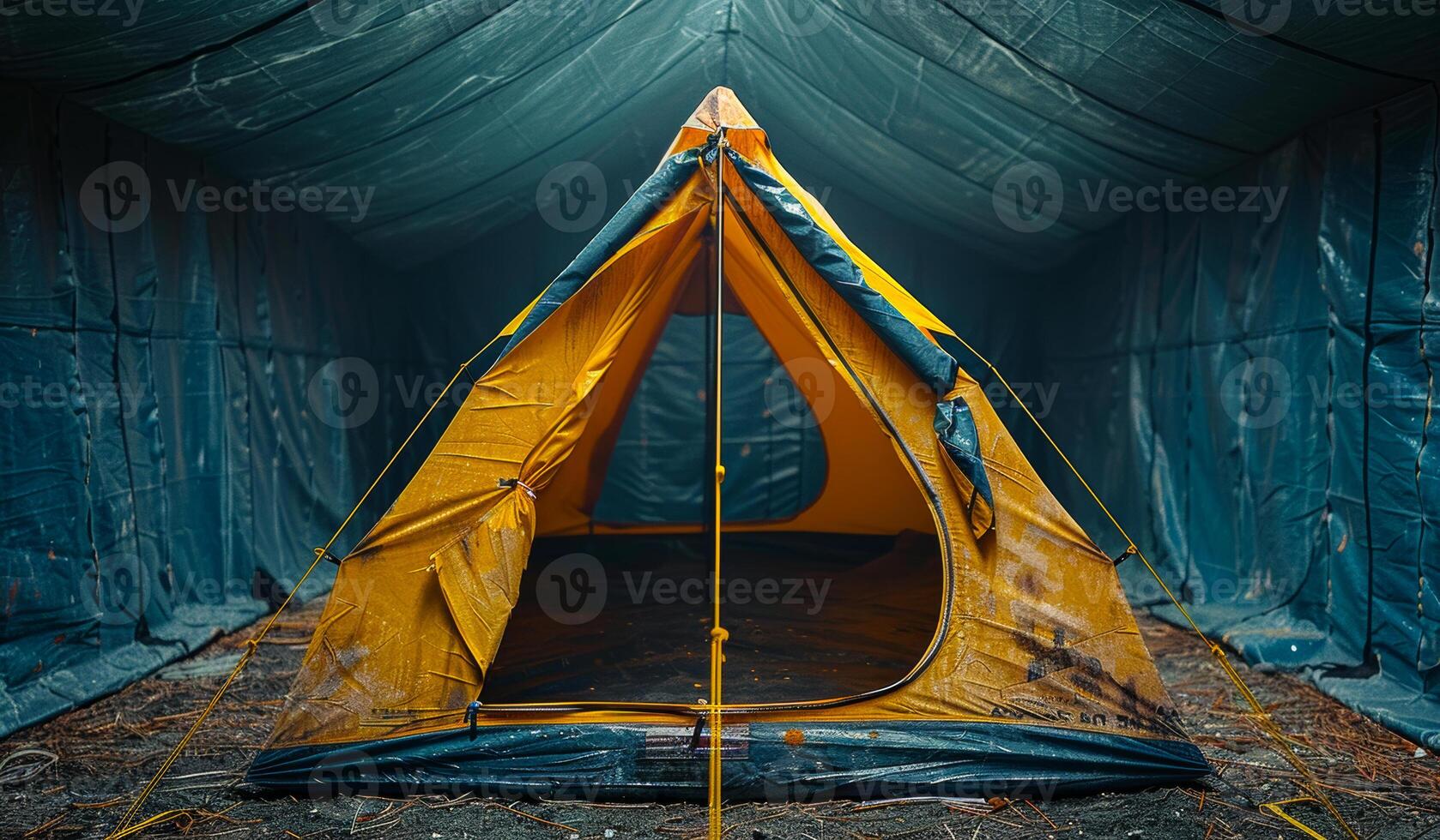 A yellow tent is in the middle of a blue room. The tent is open and has a yellow roof photo