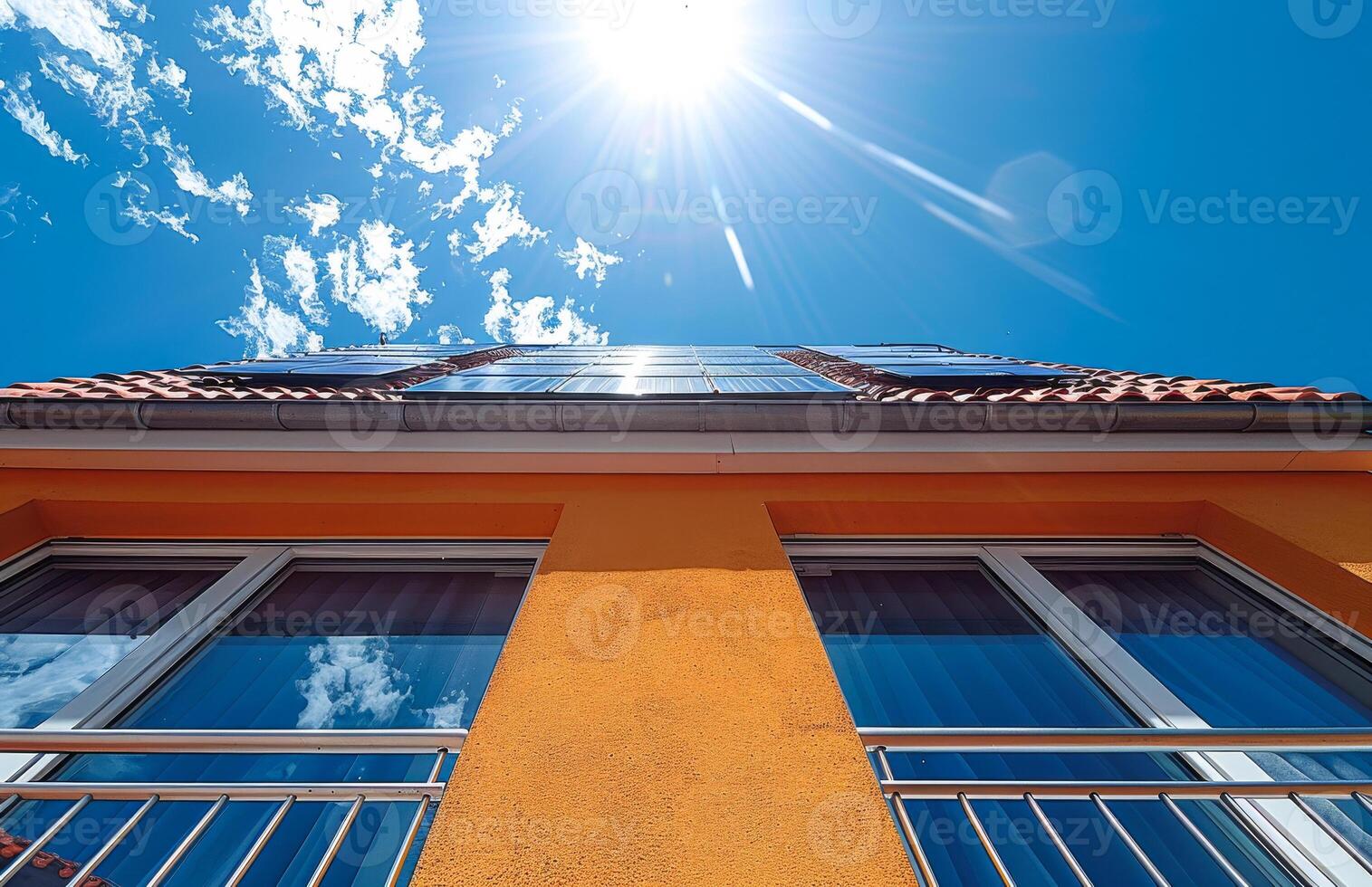 A building with a yellow exterior and blue windows photo