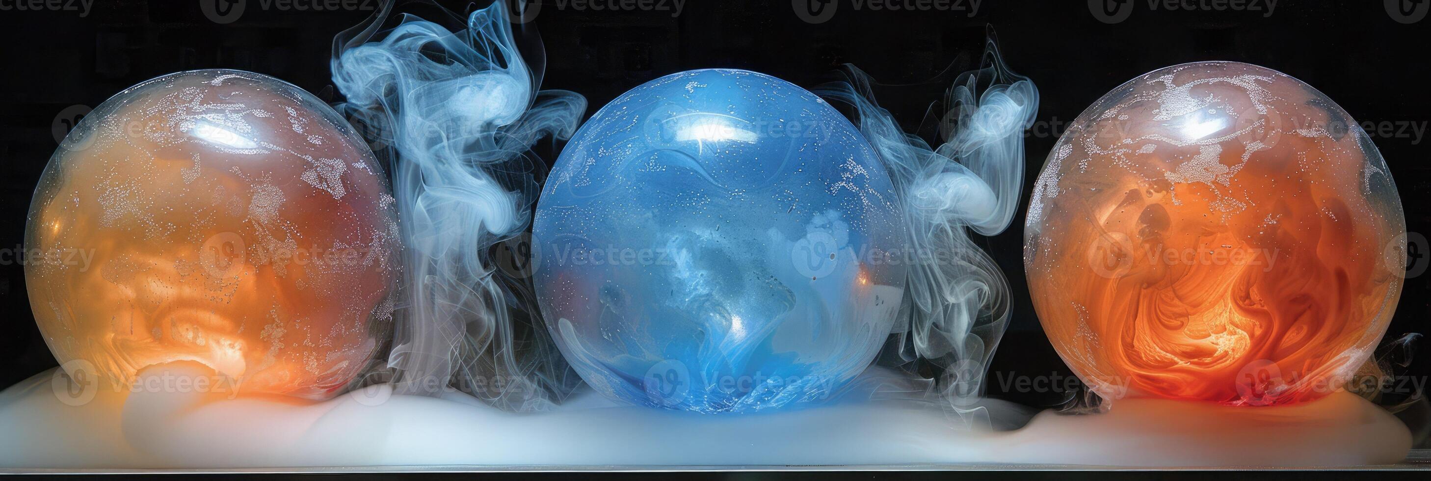 There are three balls on a table, and smoke is coming out of them photo