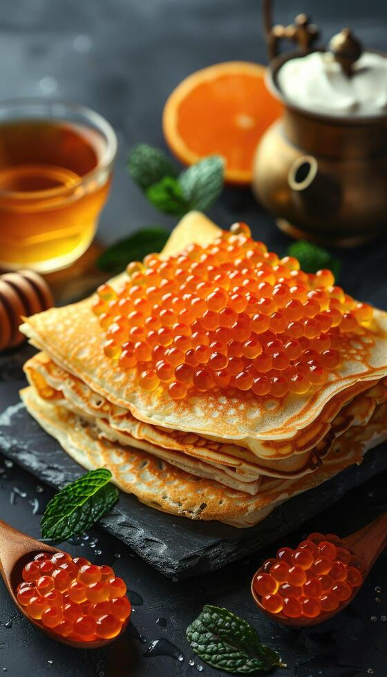 fried pancakes with red caviar photo