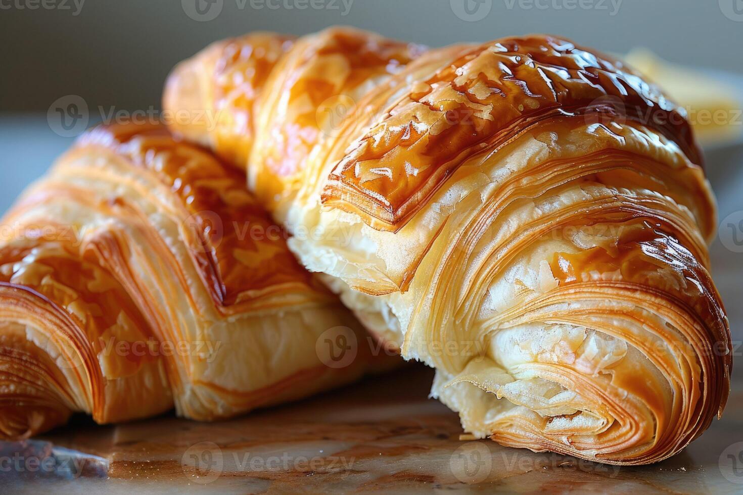 Close up of a delicious croissant, flaky texture and golden color photo