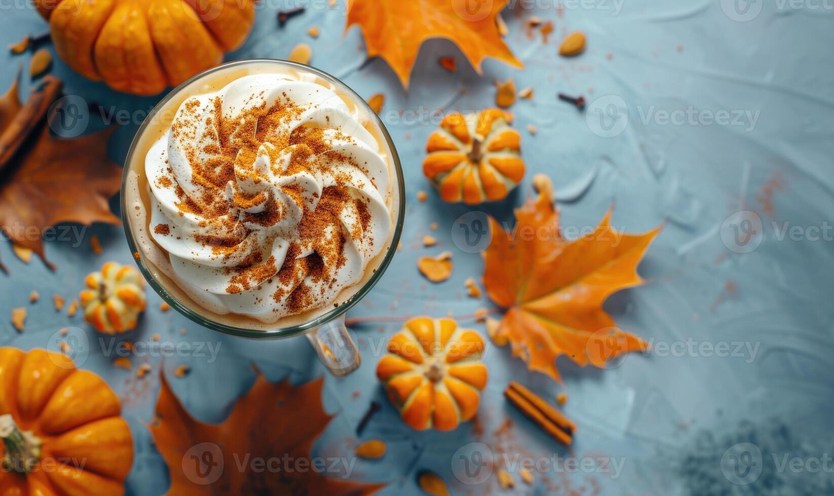 A chilled pumpkin spice latte with whipped cream and cinnamon photo