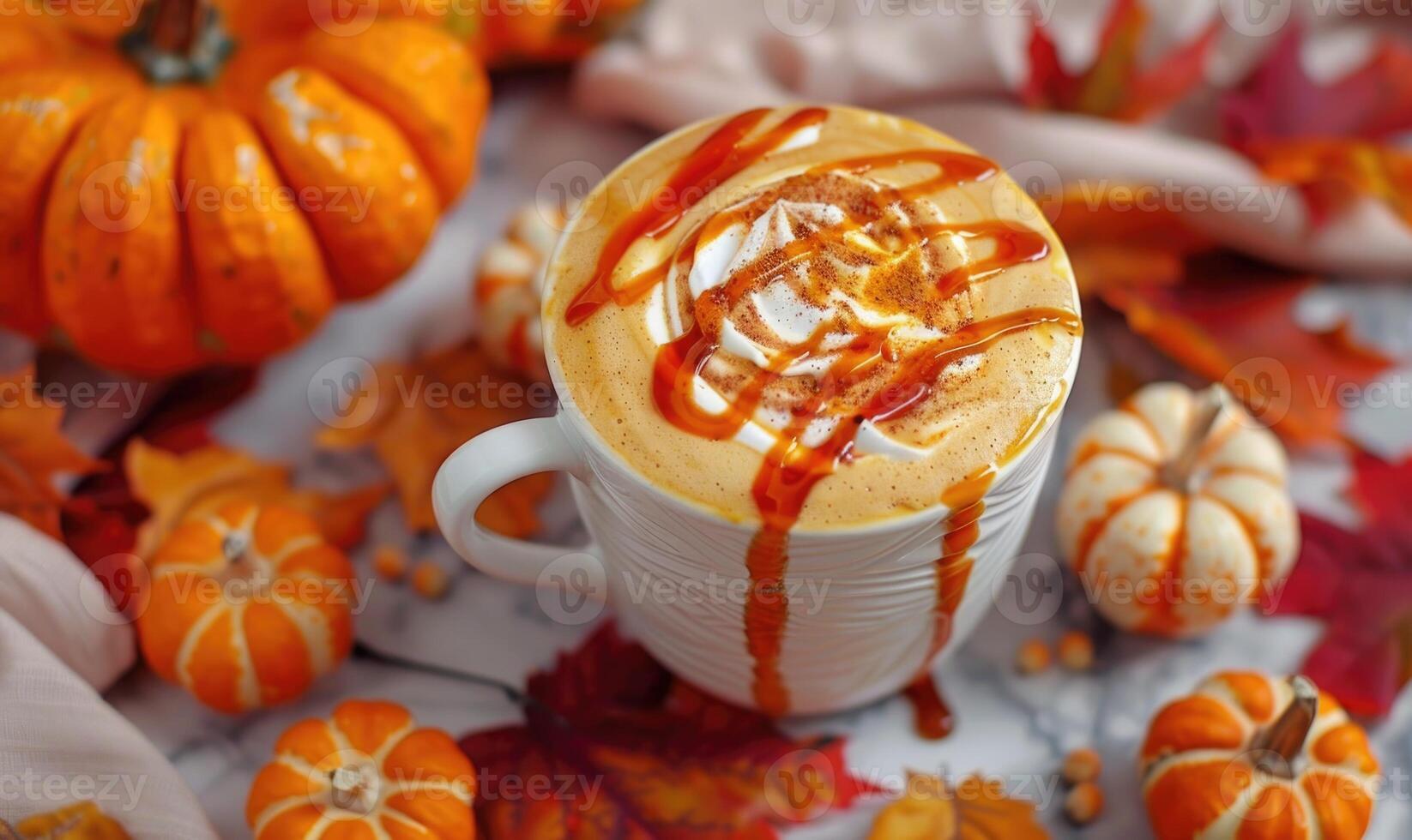 A creamy pumpkin spice latte with a drizzle of caramel photo
