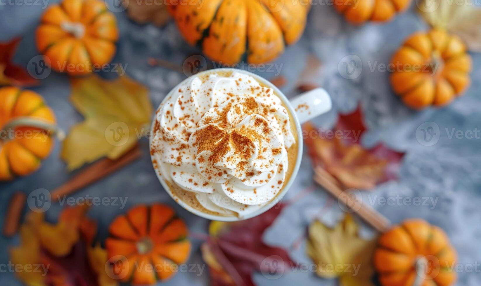 A warm pumpkin chai latte with whipped cream and cinnamon photo
