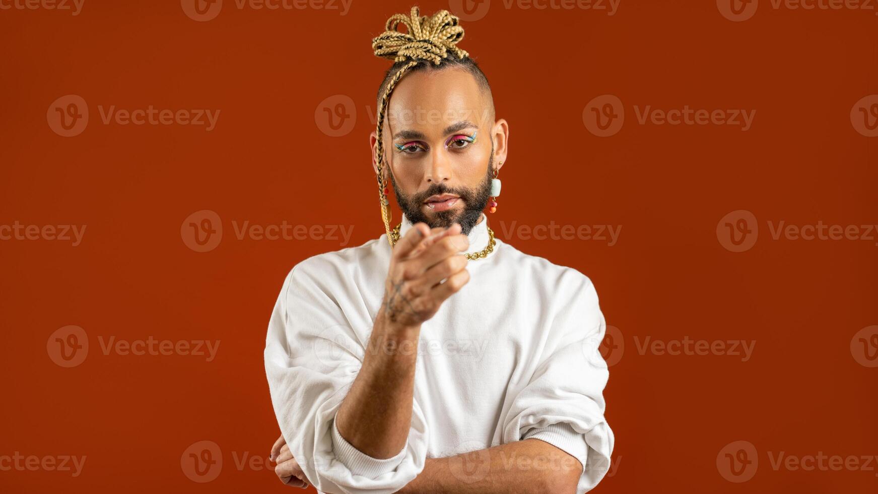 African american gay points index finger at camera photo