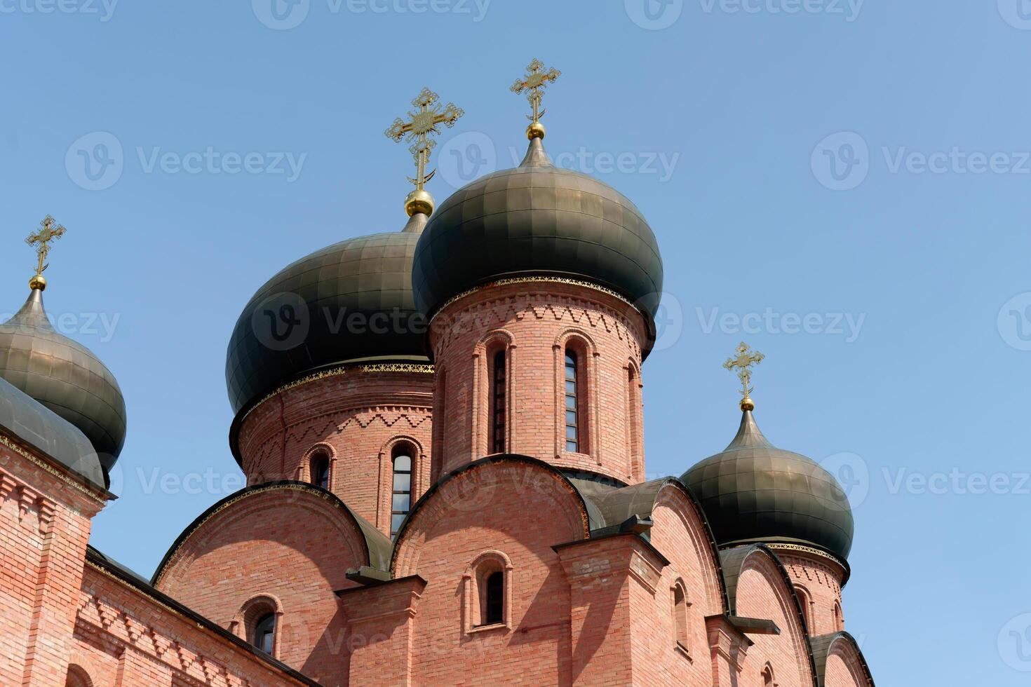 Soaring domes and ornate facades of a Russian Orthodox male monastery, a revered religious site in the Ufa diocese, exuding an aura of timeless devotion photo