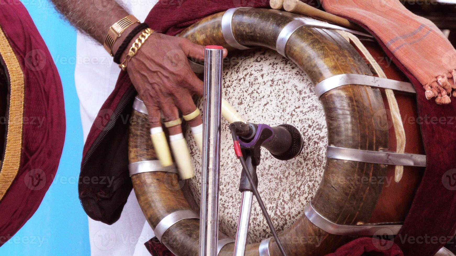 An artist playing Thavil, a South Indian traditional musical instrument photo