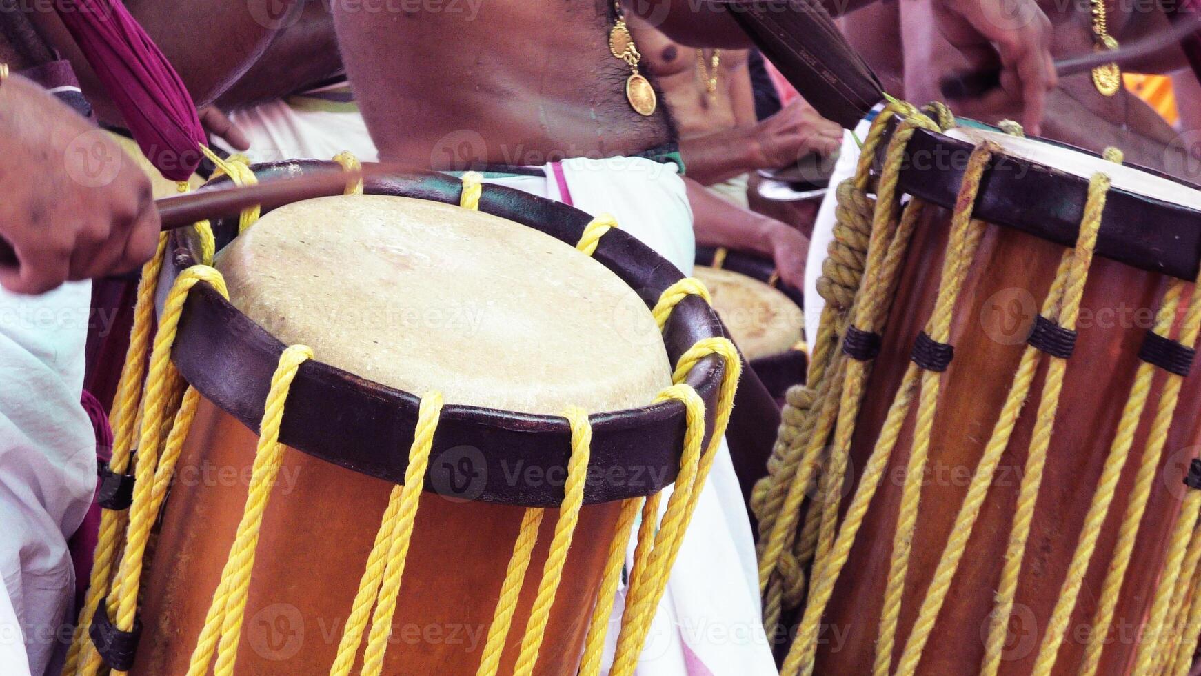 Artists playing Chenda, a South Indian traditional musical instrument photo