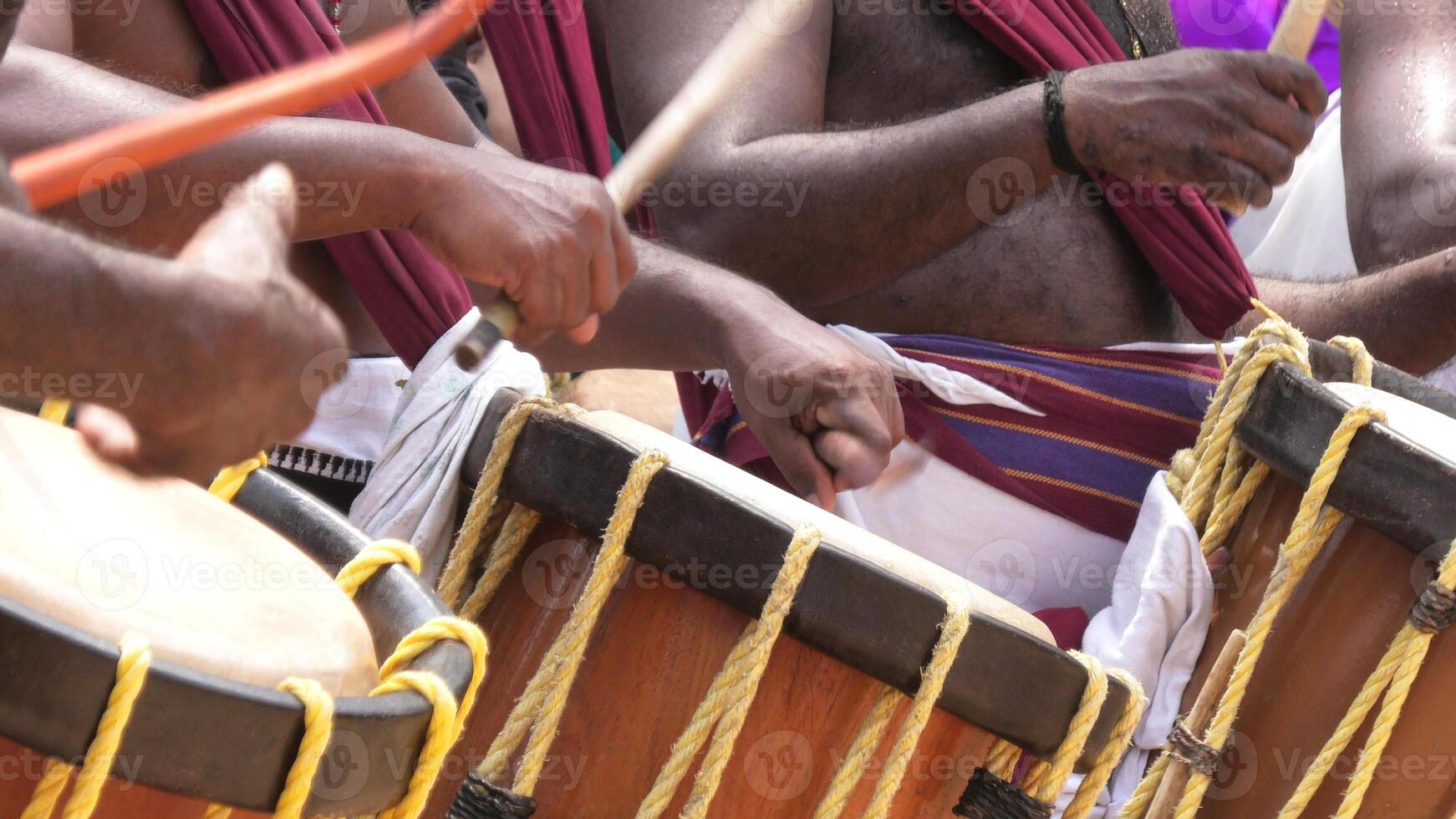 Artists playing Chenda, a South Indian traditional musical instrument photo