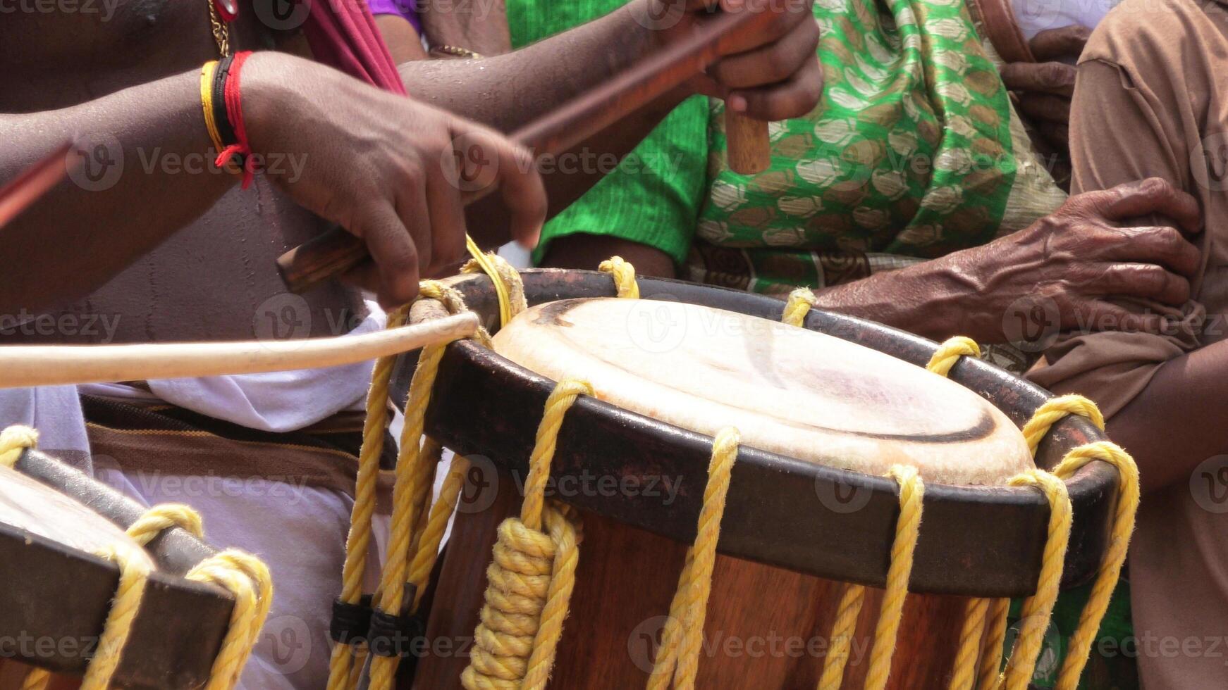 Artists playing Chenda, a South Indian traditional musical instrument photo