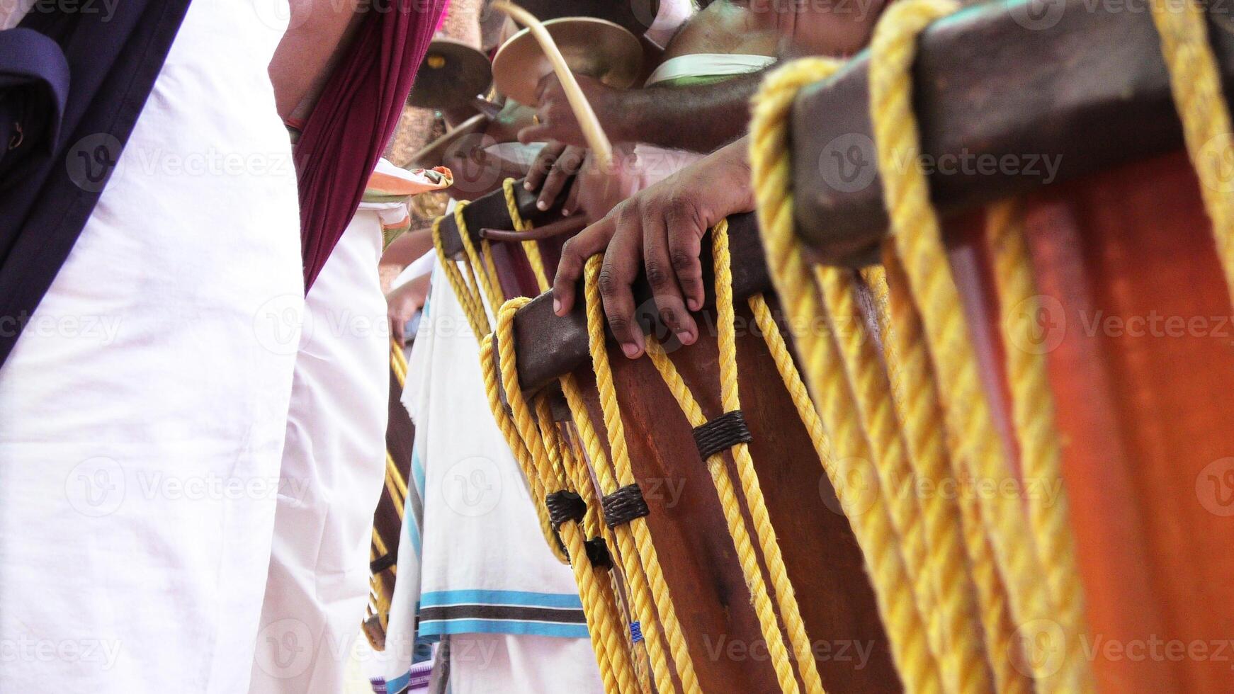 Artists playing Chenda, a South Indian traditional musical instrument photo