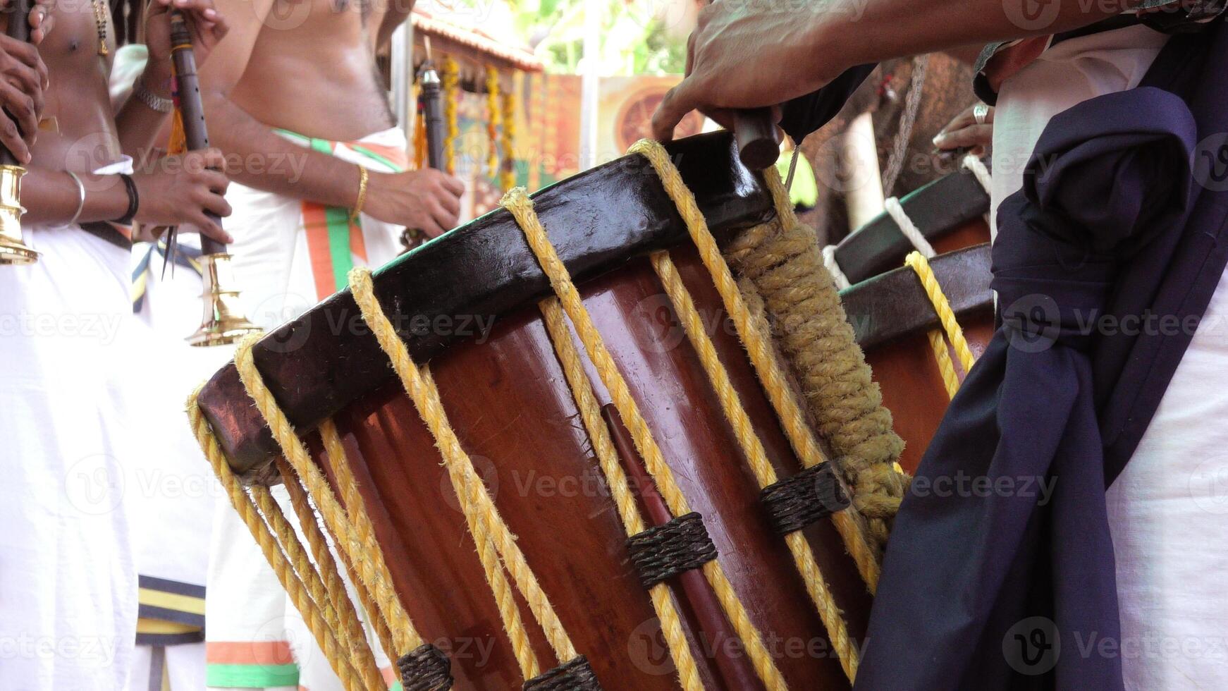 Artists playing Chenda, a South Indian traditional musical instrument photo