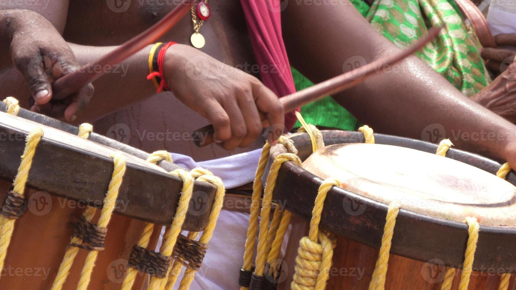 Artists playing Chenda, a South Indian traditional musical instrument photo