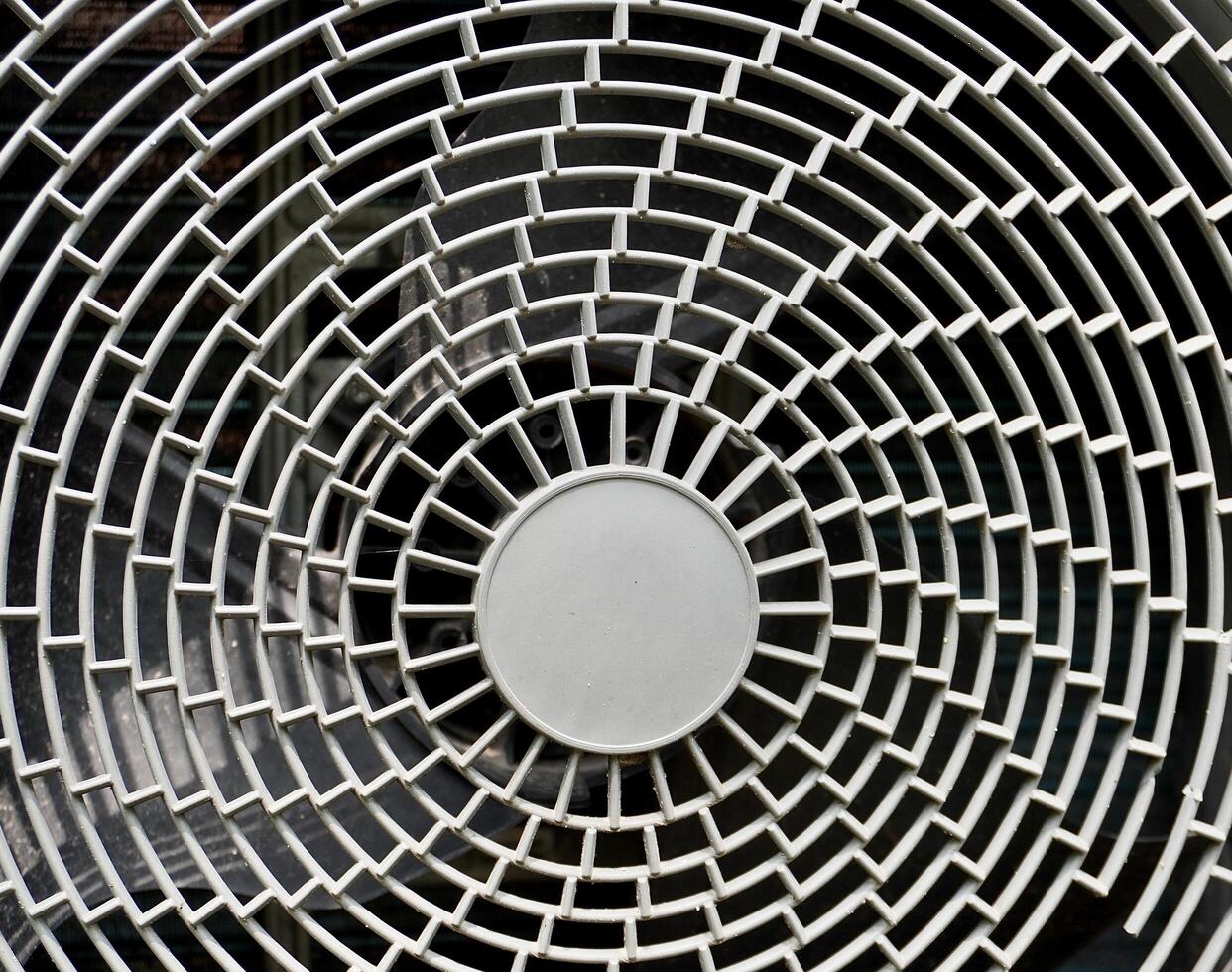 Close up gray outdoor air conditioner exhaust fan texture isolated on horizontal full frame background. photo