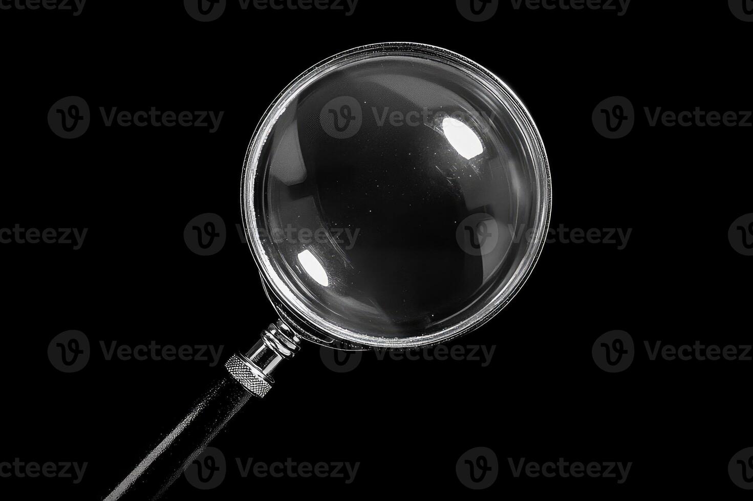 Magnifying glass on black background exploring the unknown photo