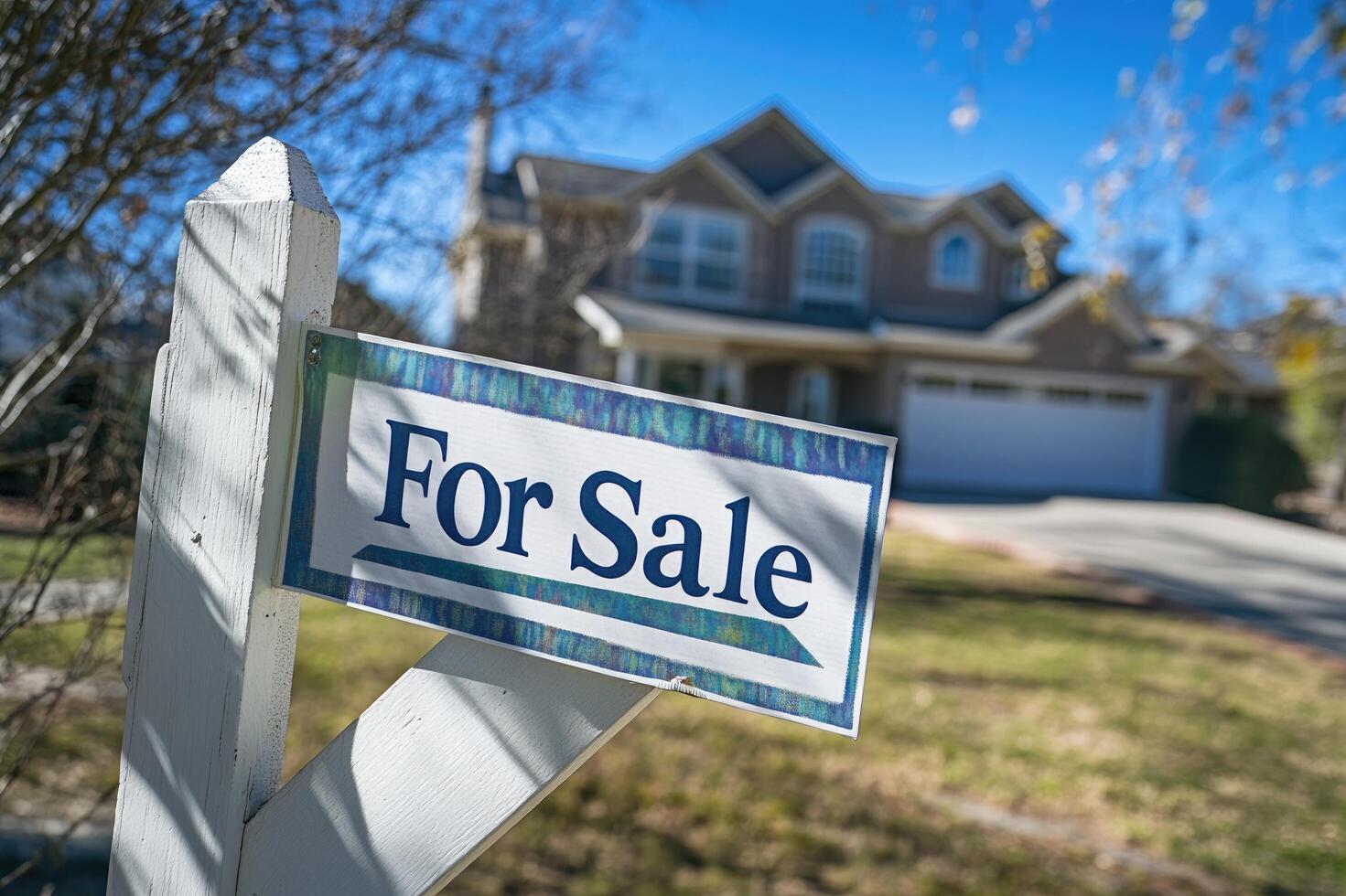 For sale sign displaying outside of a house photo