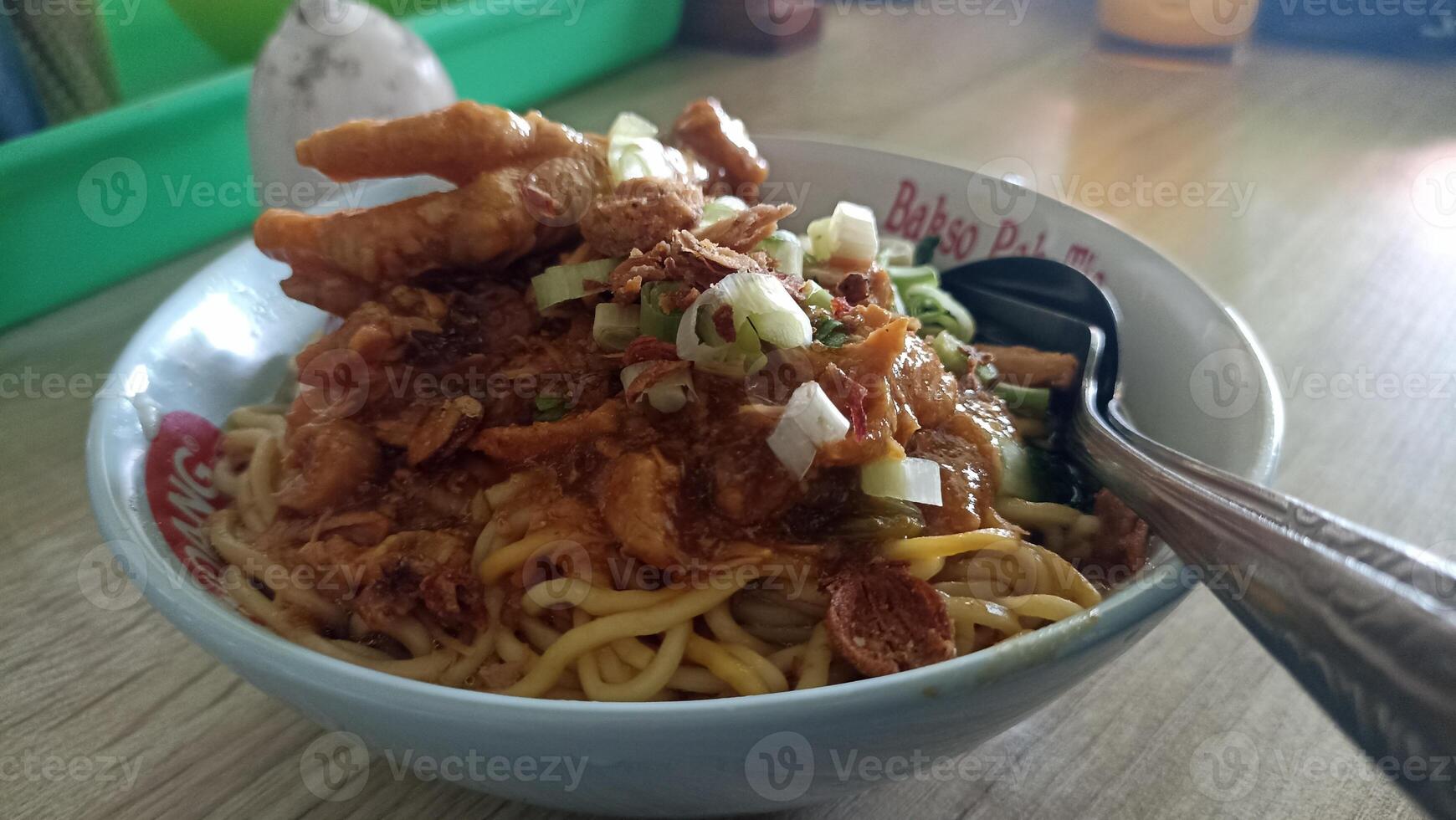 Delicious Bowl of Indonesian Chicken Noodle Soup with Fresh Vegetables photo