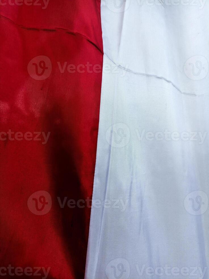 Close-Up of Indonesian Flag Fabric Showing Red and White Colors photo