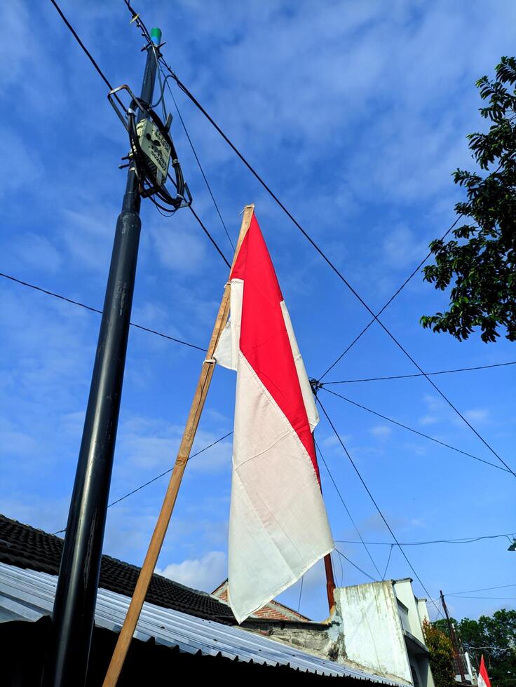 Indonesian Neighborhood Decorated with Flags for Independence Day Celebration photo