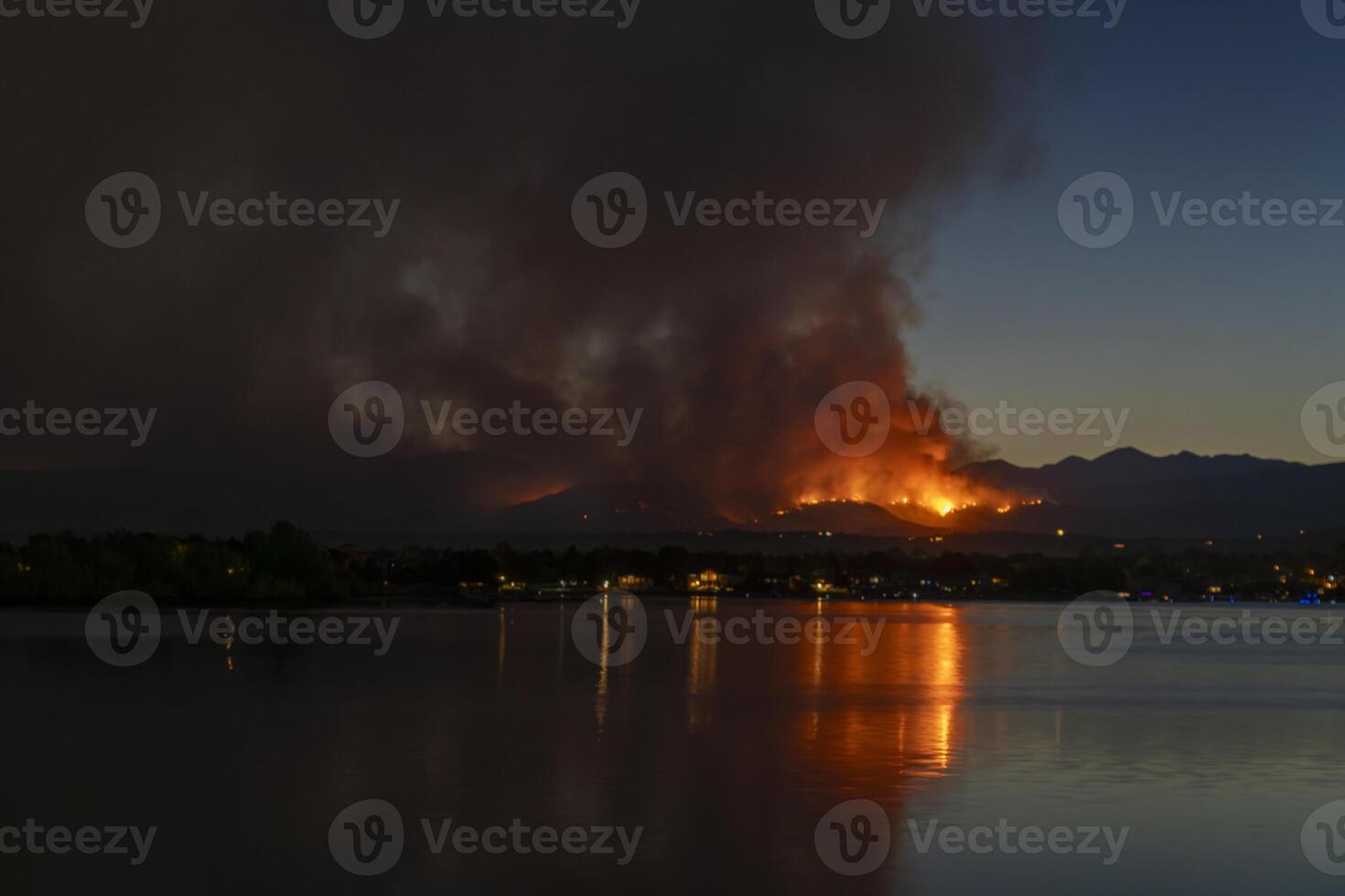 wildfire at Colorado foothills west of Loveland, smoke plume from Mount Alexander fire as seen at sunset from Boyd Lake, August 29, 2024 photo