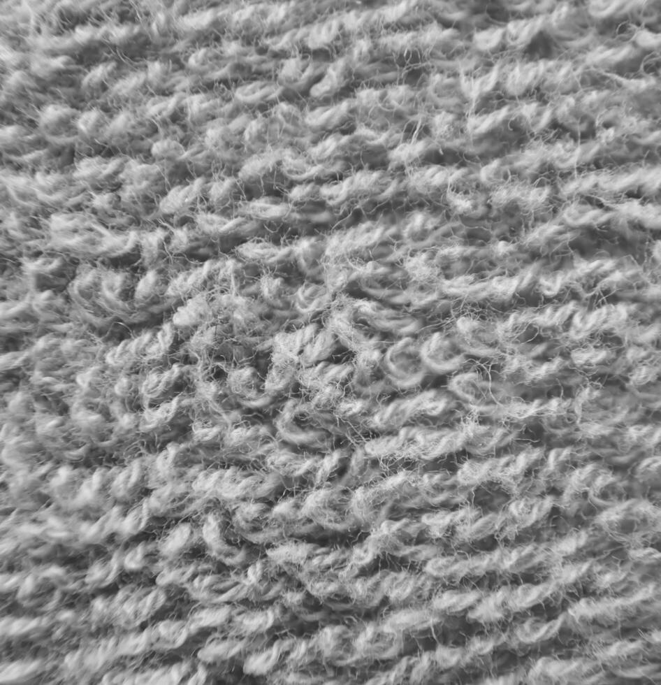 Green fluffy cloth close view. Black and white monochrome grayscale photo background.