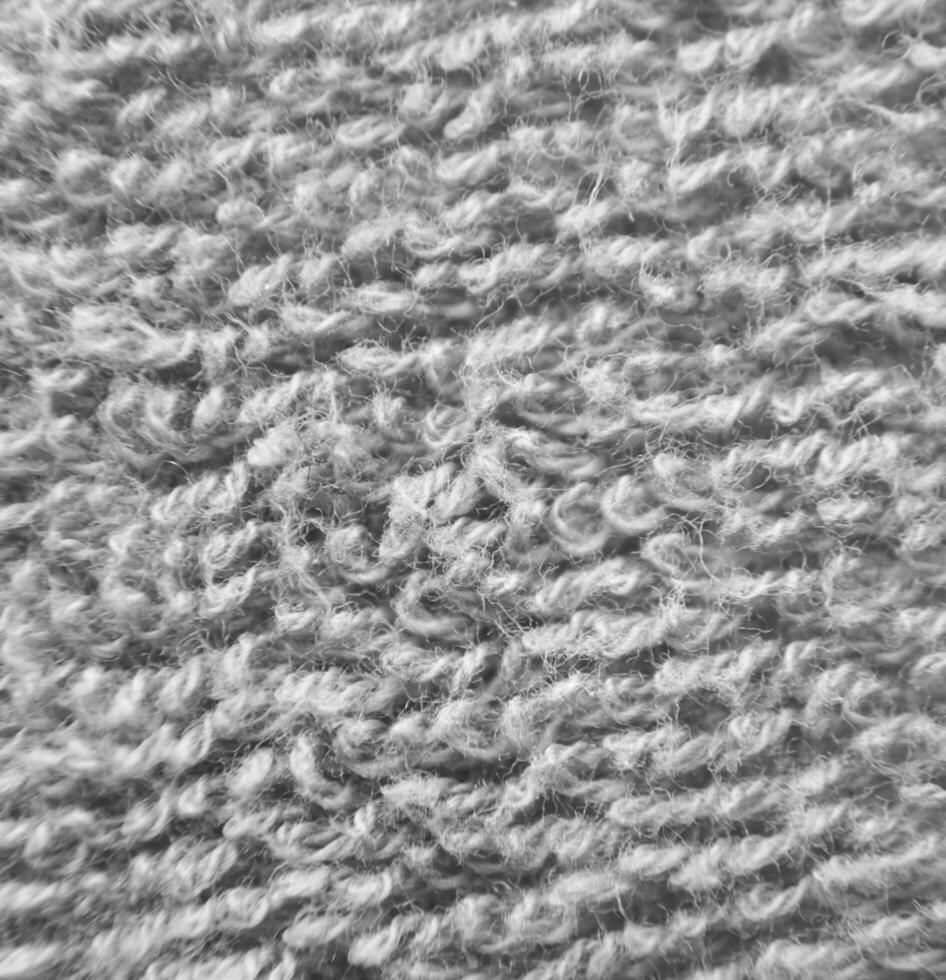 Green fluffy cloth close view. Black and white monochrome grayscale photo background.