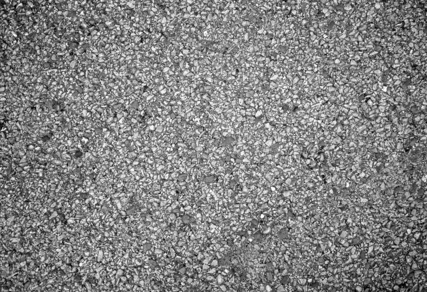 Stone wall pattern, natural stone texture, ground pavement background. Black and white photo background