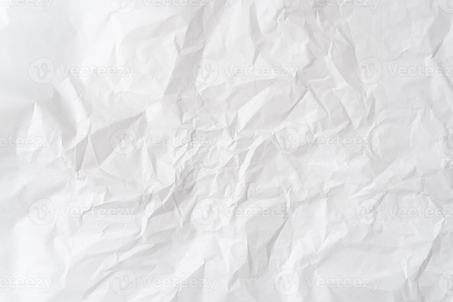 Top view and full frame of white wrinkled or crumpled stencil paper background texture used for crumpled paper background texture in decorative art work photo