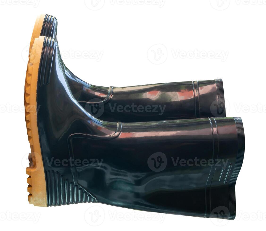A pair of black gumboots or black boots for working in garden isolated on white background with clipping path photo