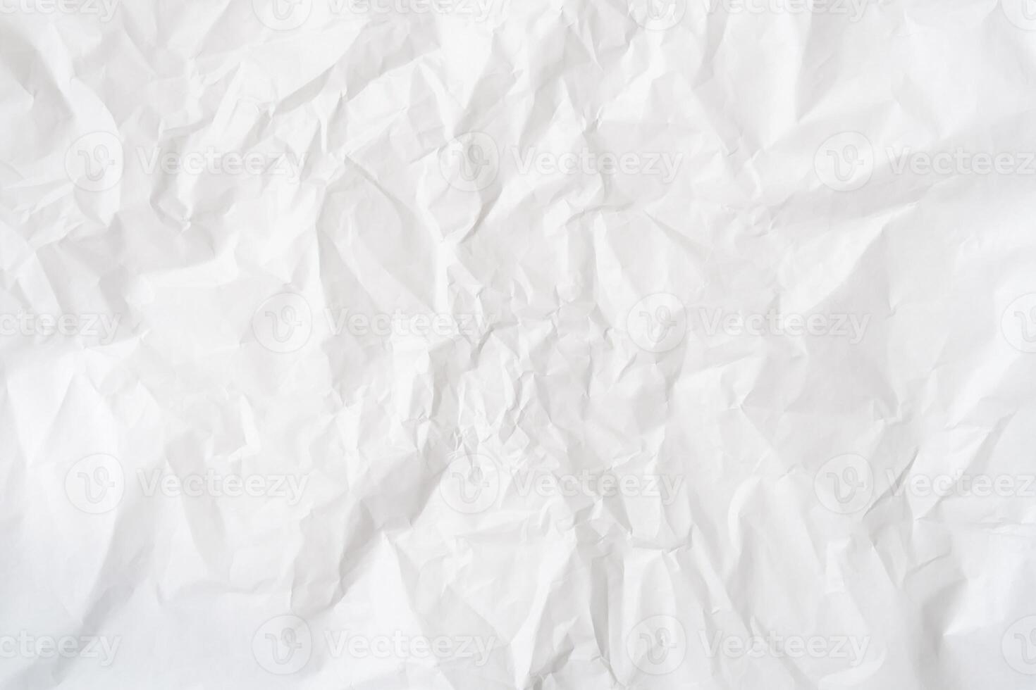 Top view of wrinkled or crumpled white stencil paper used for wrinkled or crumpled white paper background texture photo