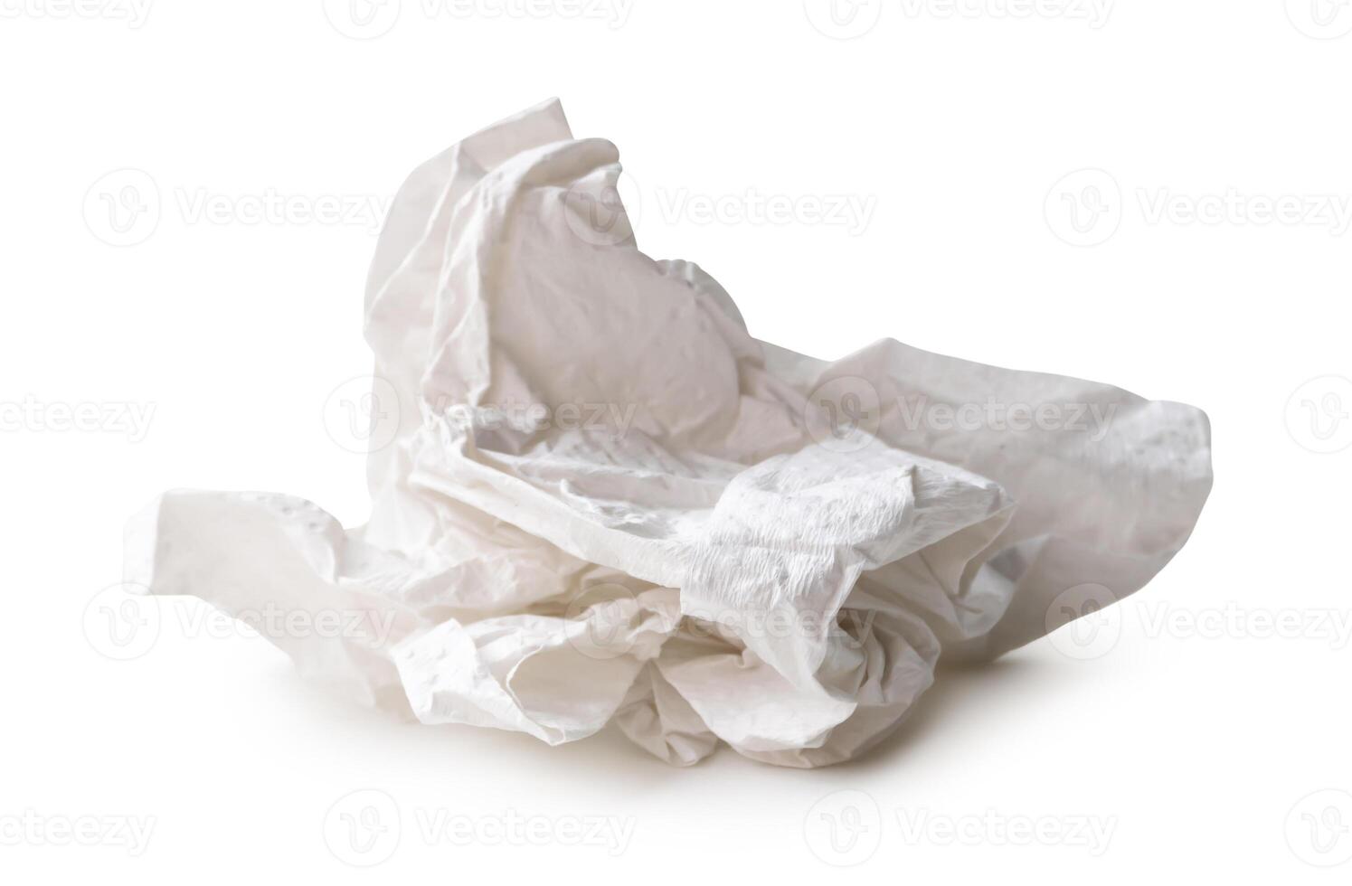 Side view of white screwed or crumpled tissue paper ball after use isolated on white background with clipping path photo