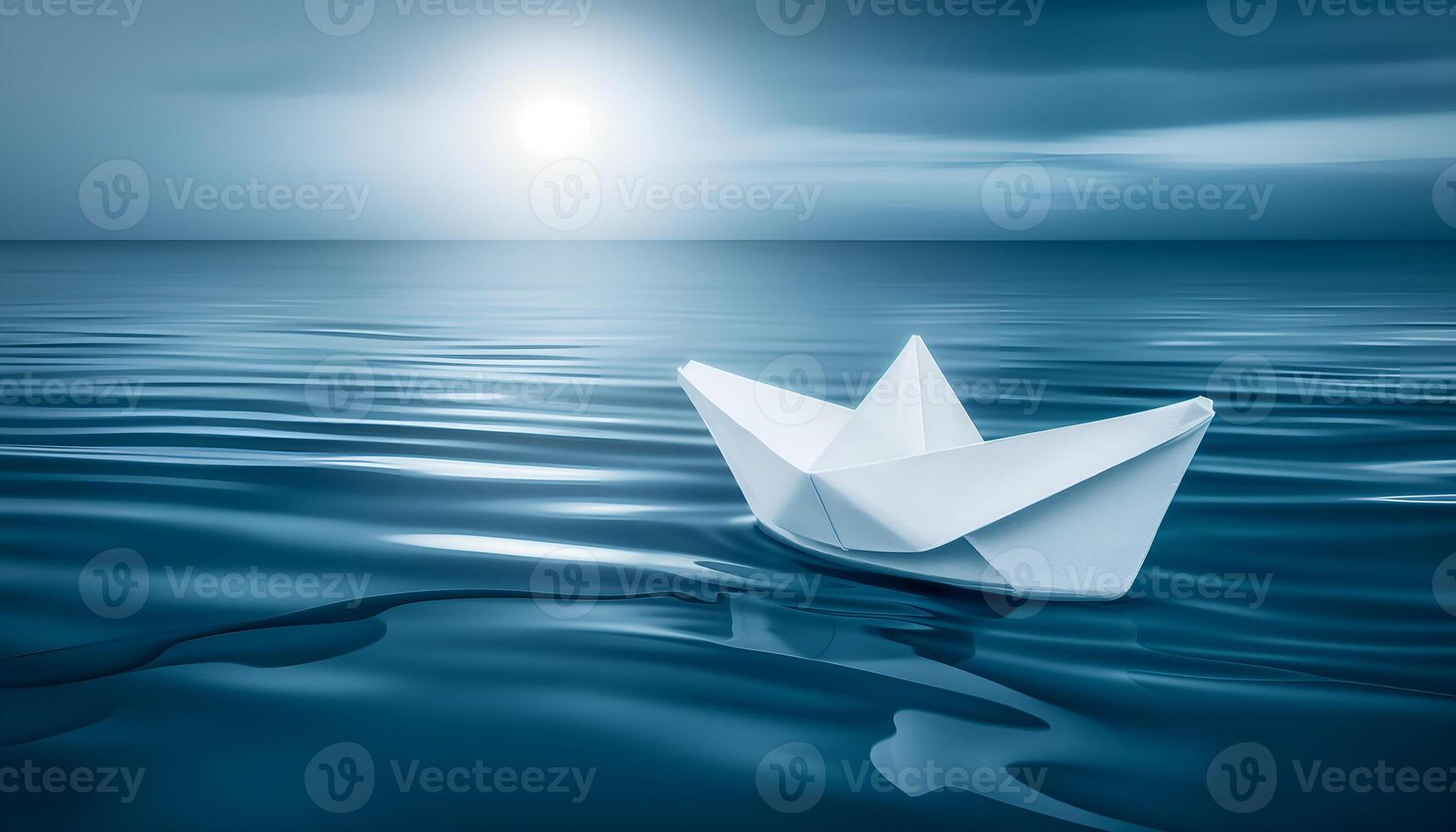 paper boat on blue water photo