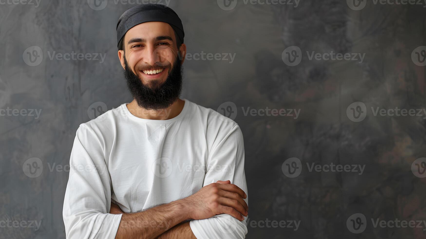Smiling Muslim Man with Beard and Crossed Arms Pose photo
