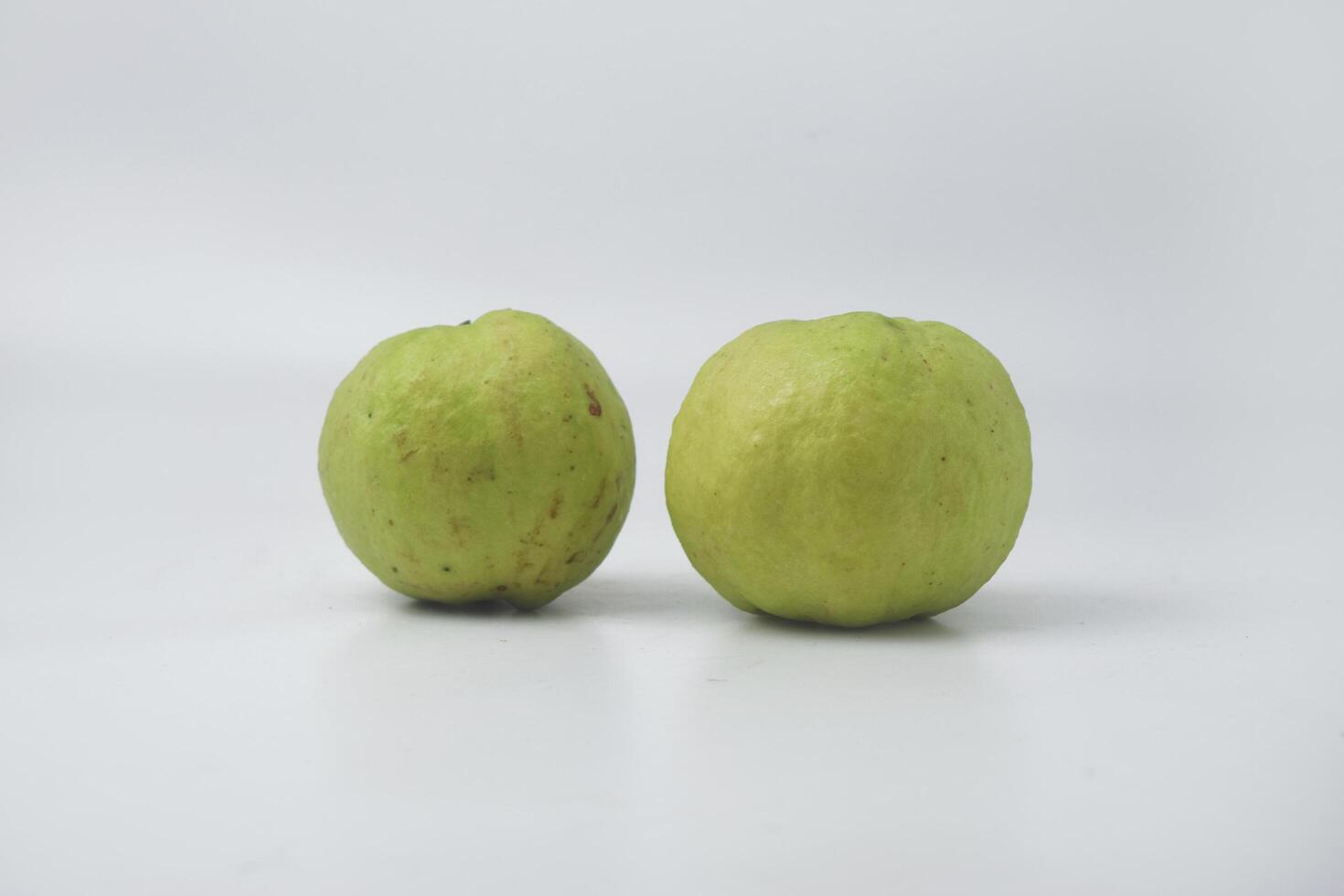 Fresh green guava is on an isolate white background photo