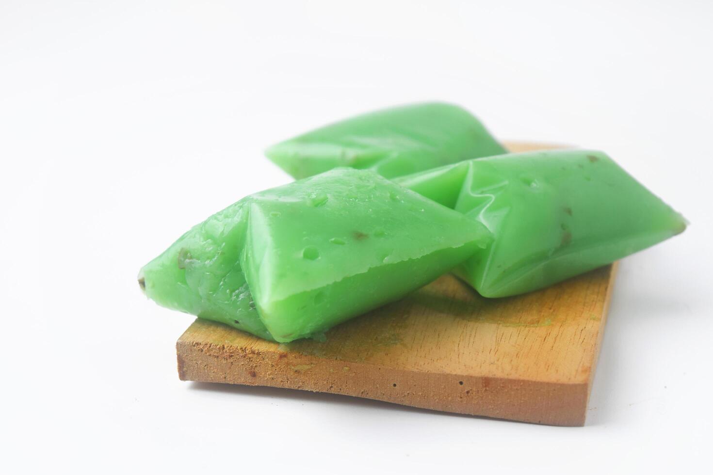 A typical Indonesian snack often called Kue Jentik Manis is on a wooden coaster photo