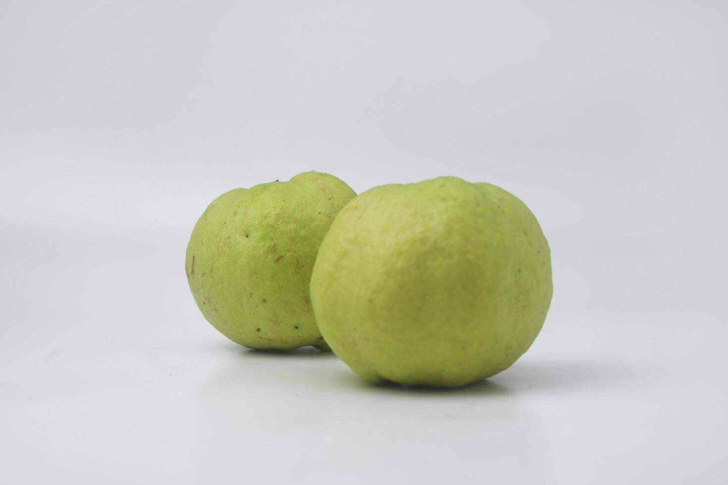 Fresh green guava is on an isolate white background photo