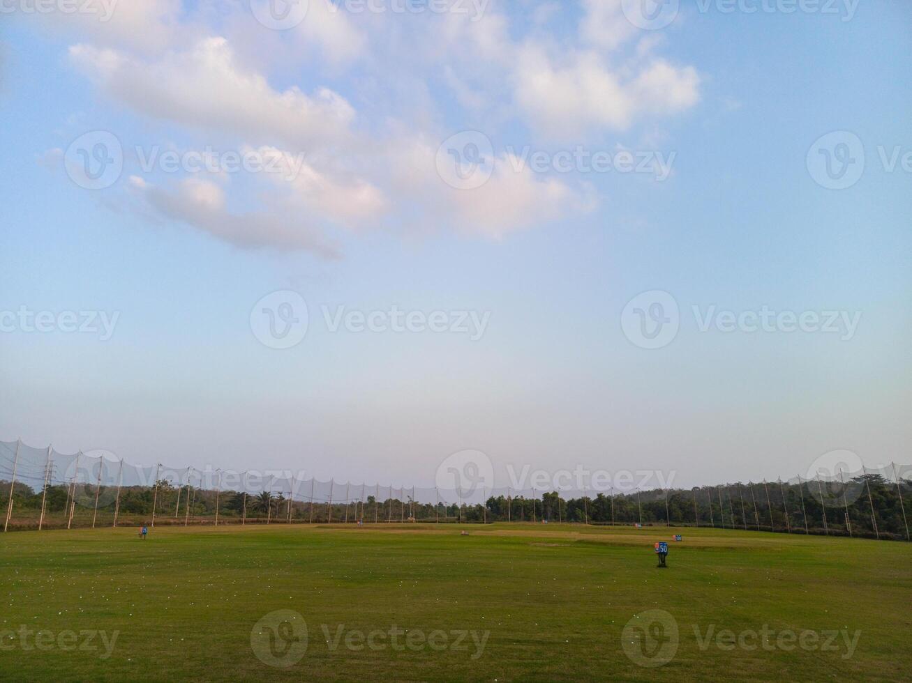 photo of a field where you can practice hitting golf balls, usually called a driving range