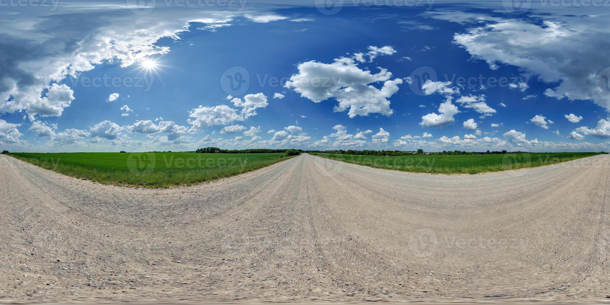 hdri 360 panorama of blue sky with awesome clouds on roadside of gravel road among fields in equirectangular full seamless spherical projection, for VR AR content or skydome replacement photo