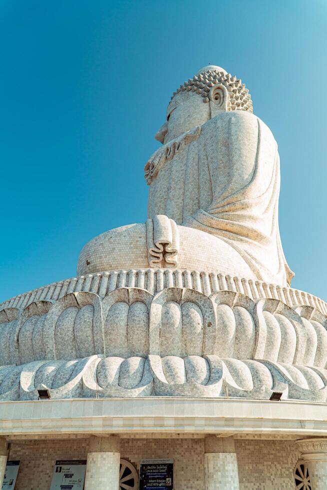 The giant statue of the Big Buddha is an iconic landmark made of concrete covered with white marble located on a hill with beautiful views in Phuket, Thailand on March 24, 2024 photo