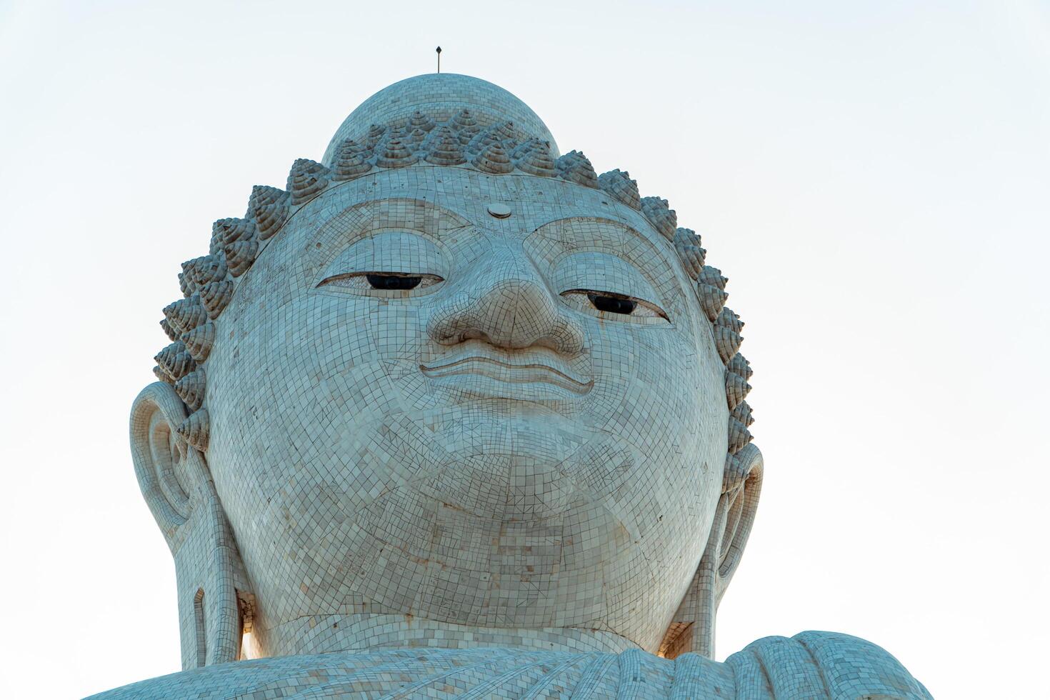 The giant statue of the Big Buddha is an iconic landmark made of concrete covered with white marble located on a hill with beautiful views in Phuket, Thailand on March 24, 2024 photo