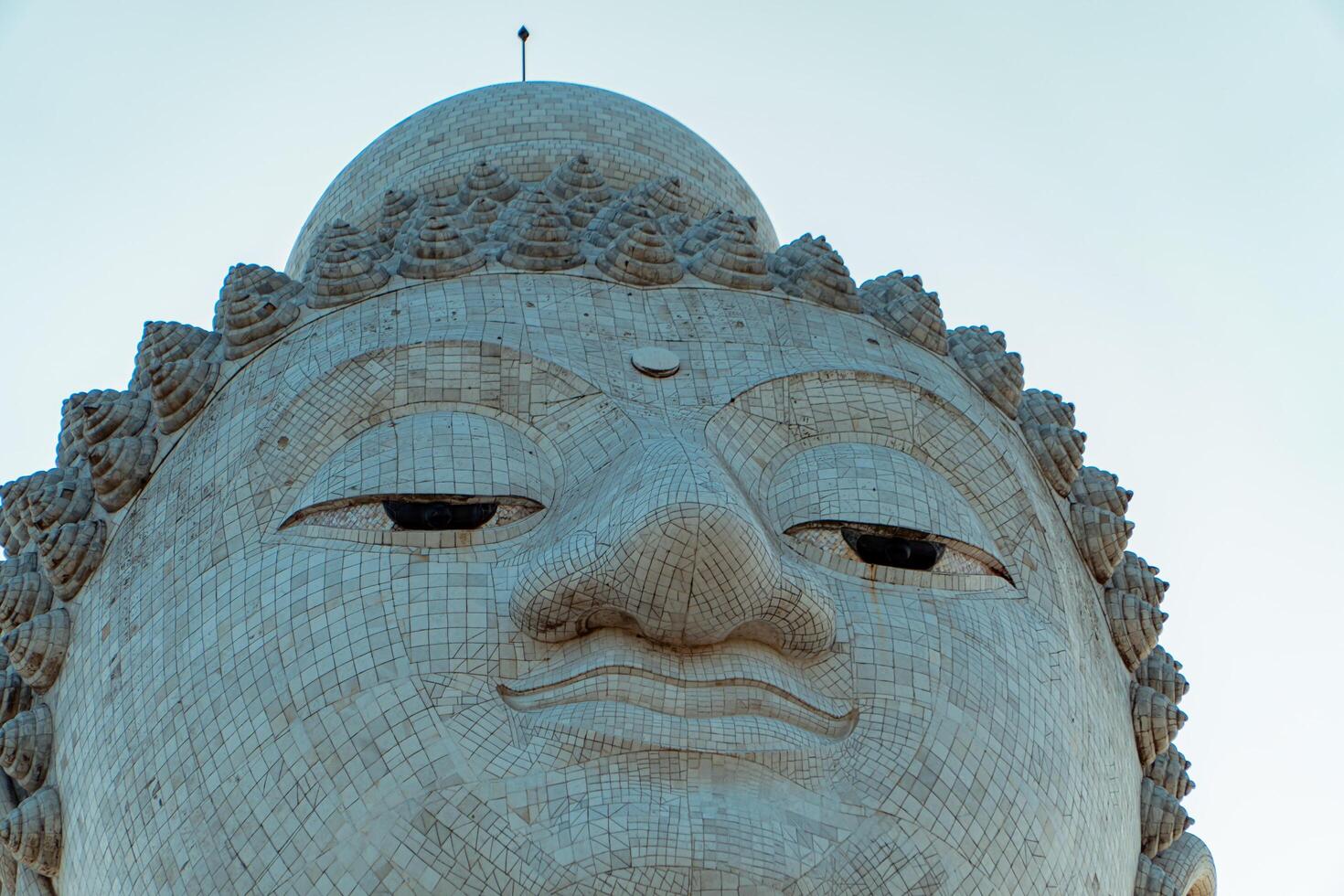 The giant statue of the Big Buddha is an iconic landmark made of concrete covered with white marble located on a hill with beautiful views in Phuket, Thailand on March 24, 2024 photo