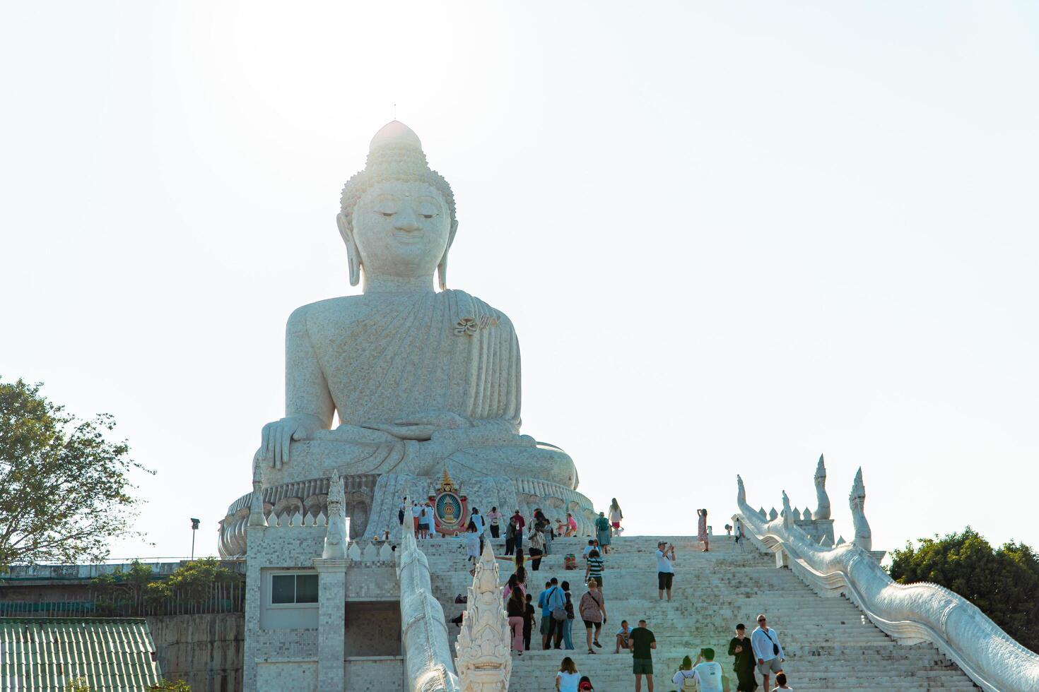 The giant statue of the Big Buddha is an iconic landmark made of concrete covered with white marble located on a hill with beautiful views in Phuket, Thailand on March 24, 2024 photo