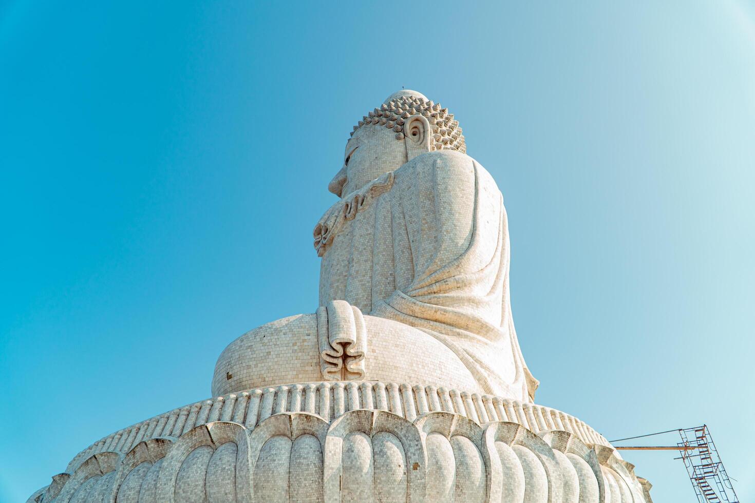 The giant statue of the Big Buddha is an iconic landmark made of concrete covered with white marble located on a hill with beautiful views in Phuket, Thailand on March 24, 2024 photo
