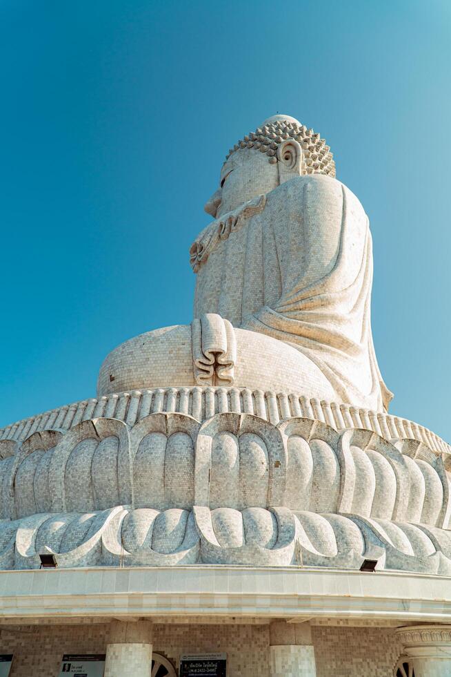 The giant statue of the Big Buddha is an iconic landmark made of concrete covered with white marble located on a hill with beautiful views in Phuket, Thailand on March 24, 2024 photo