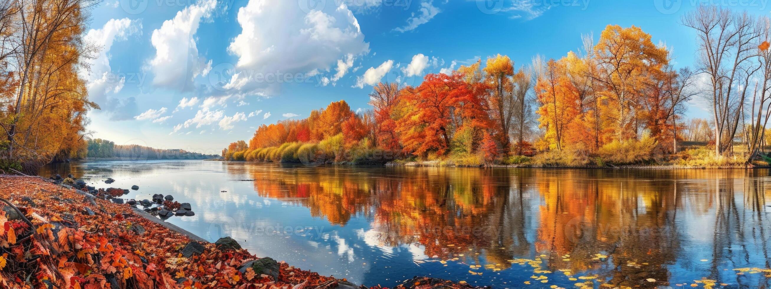 Beautiful autumn landscape with vibrant red and golden trees reflected in a calm river. Concept of fall foliage, peaceful nature scene, and seasonal change. Banner photo