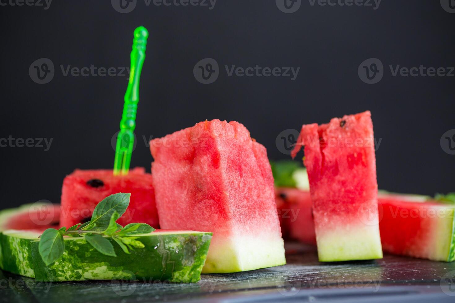 pieces of ripe red watermelon, close-up, on a board photo