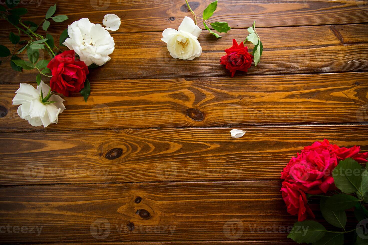 beautiful background of many red roses on a dark wooden background photo