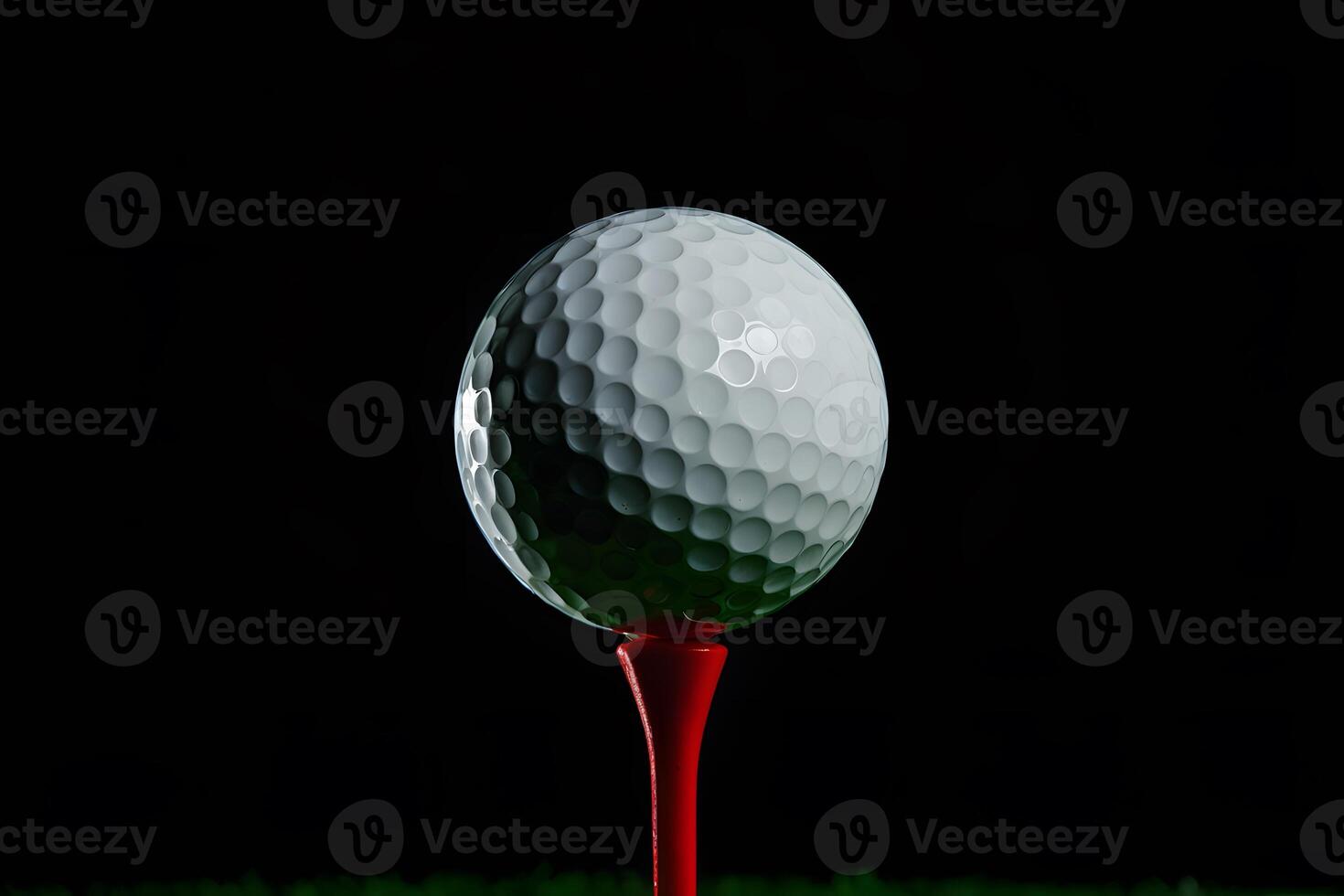 Golf ball on red tee, dark backdrop, illuminated texture, contrast focus photo